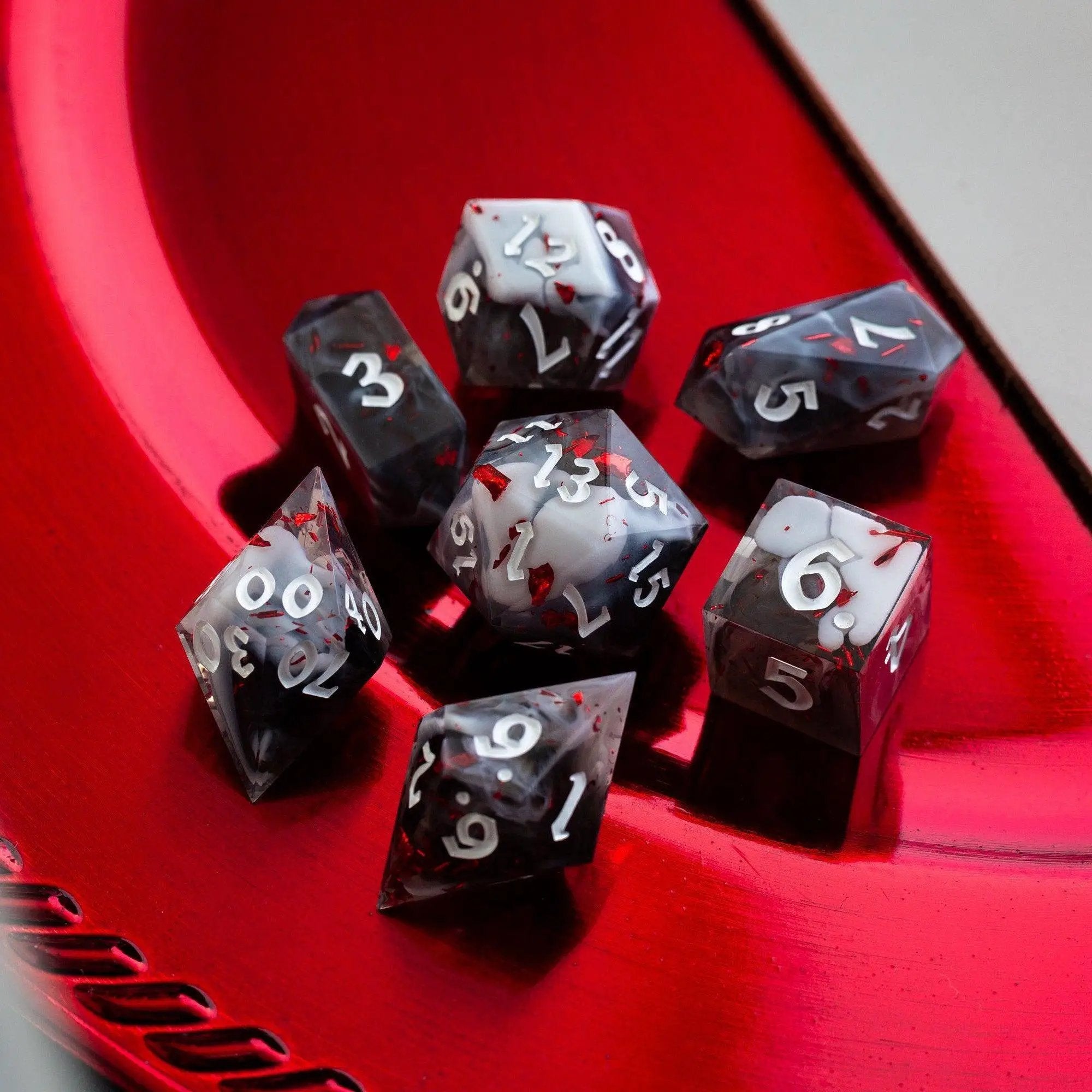 Smoke and Blood handmade resin DND dice set by Runic Dice, featuring smoky and blood-red colored polyhedral gaming dice.