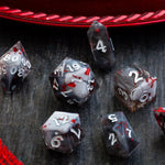 Smoke and Blood handmade resin DND dice set by Runic Dice, featuring dark, smoky colors and intricate blood-red accents.