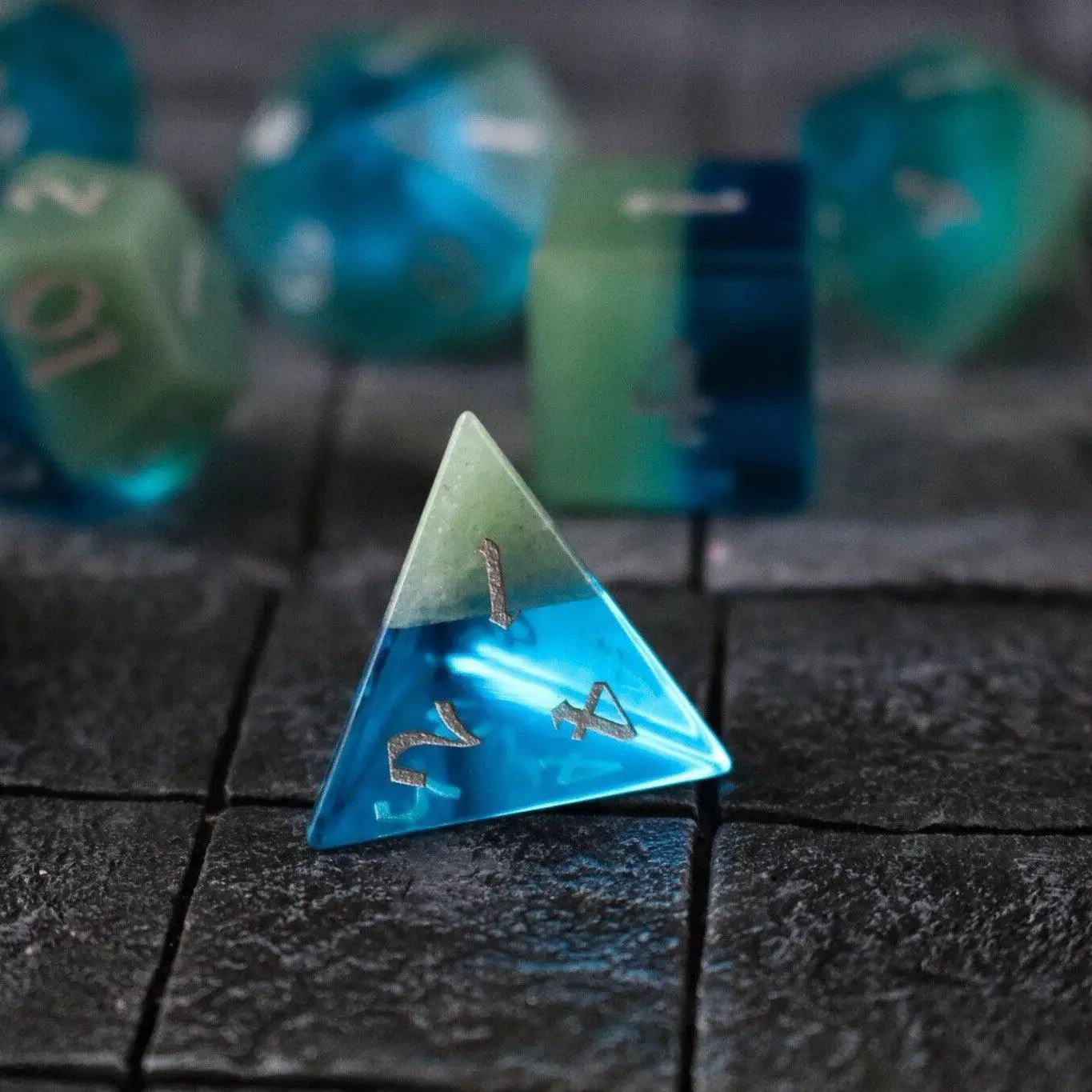 Runic Dice synthetic gemstone two-tone blue and green hand-carved D&D dice set, detailed gemstone dice for tabletop gaming.