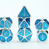 Silver metal dice set with light blue enamel accents from Tales of the Valiant by THE MIGHTY HOBBY SHOP.