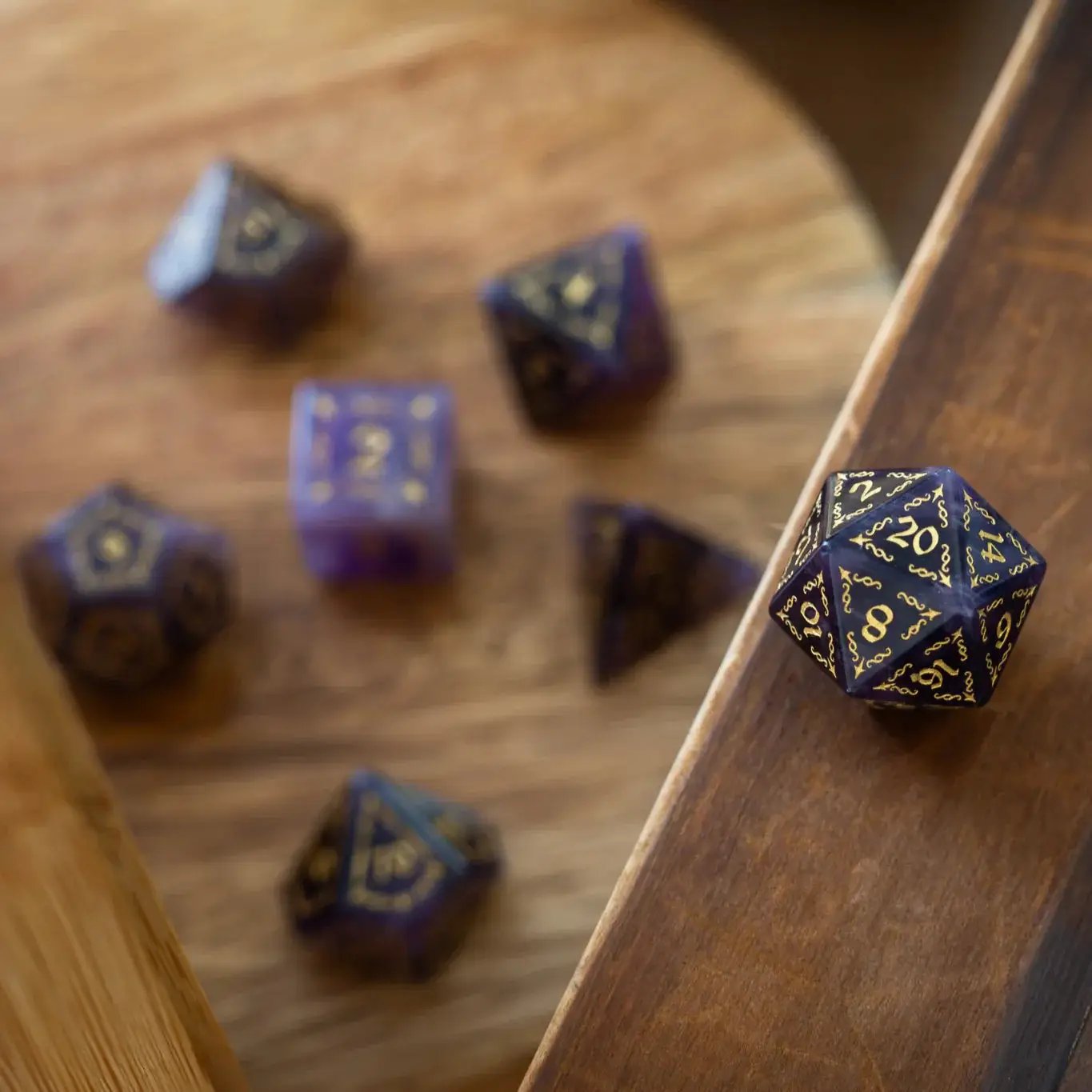 Purple Amethyst gemstone DND dice set by Runic Dice featuring vine spike design, perfect for tabletop role-playing games.