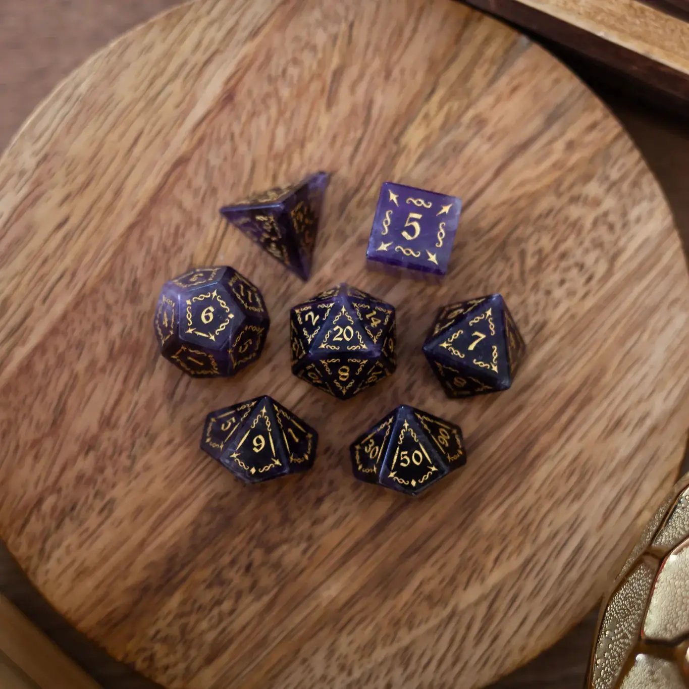 Purple Amethyst gemstone DND dice set with vine spike design by Runic Dice, showcasing polished, multi-sided gemstone dice.