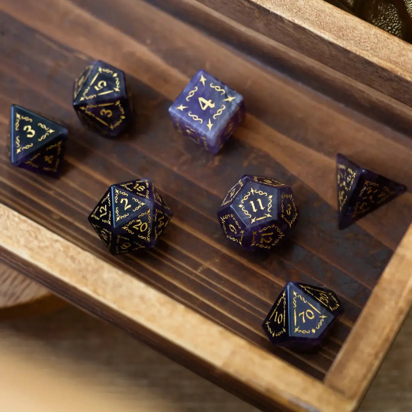 Purple amethyst gemstone DND dice set featuring vine spike design by Runic Dice, with six intricately crafted gemstone dice.