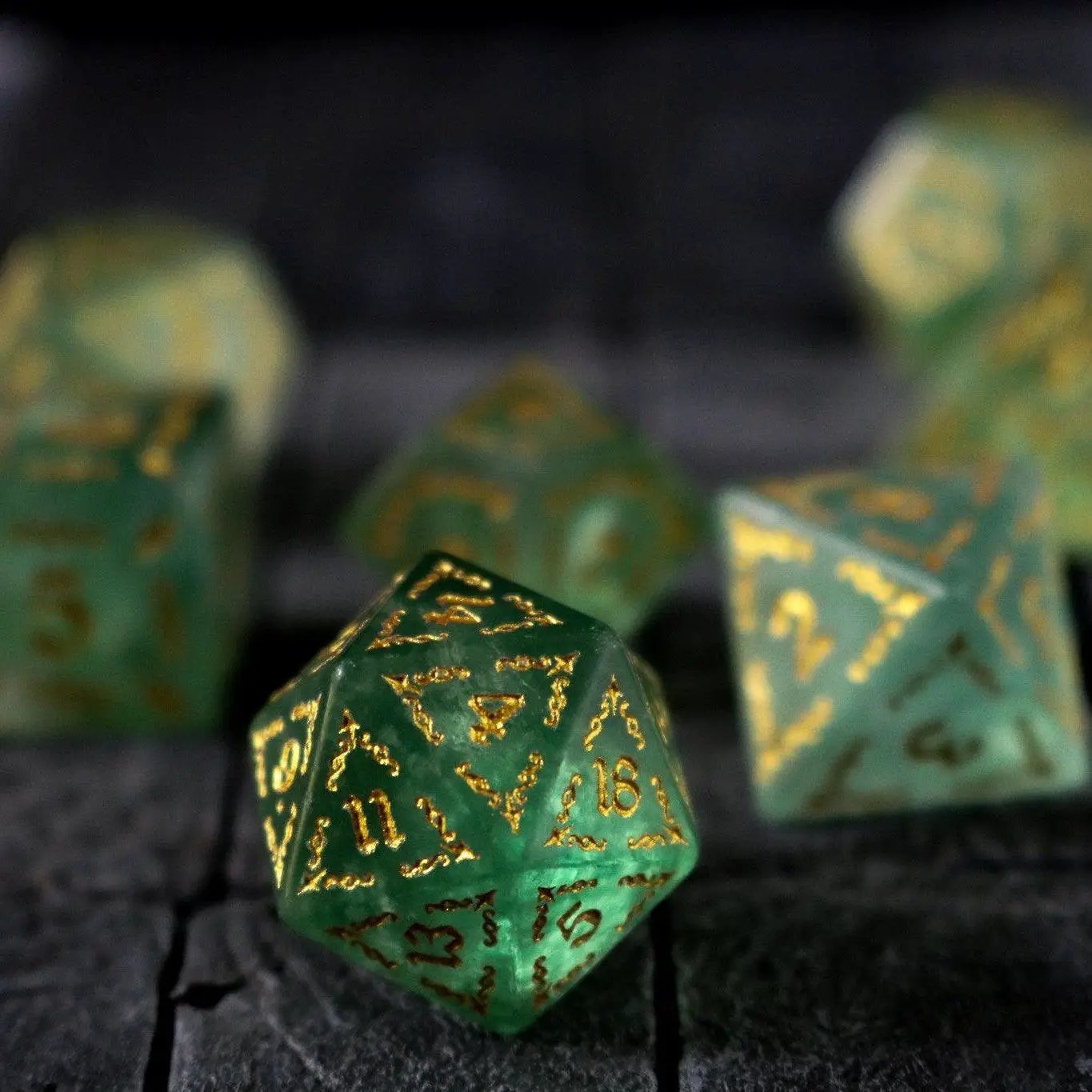 Green fluorite gemstone DND dice set with vine spike design by Runic Dice, featuring polished, colorful gemstone dice for tabletop gaming.