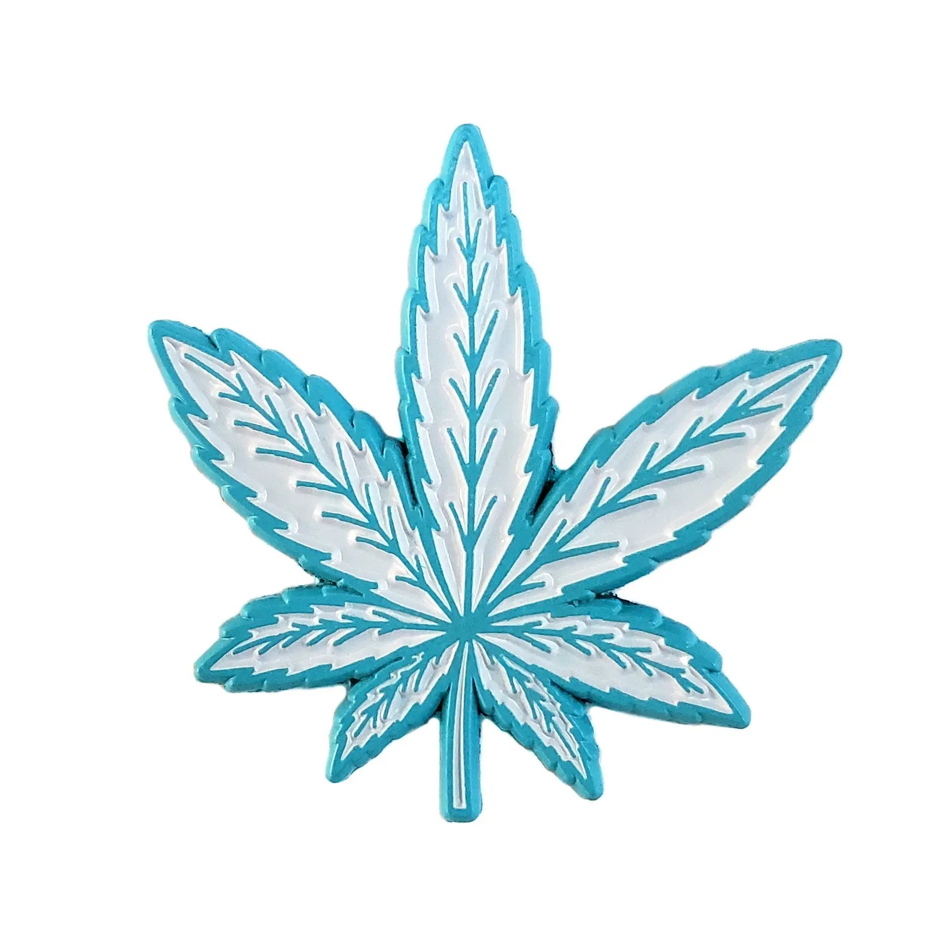 Kolorspun weed leaf pin in blue, a detailed metal accessory with a cannabis leaf design, perfect for wearable cannabis-themed decor.