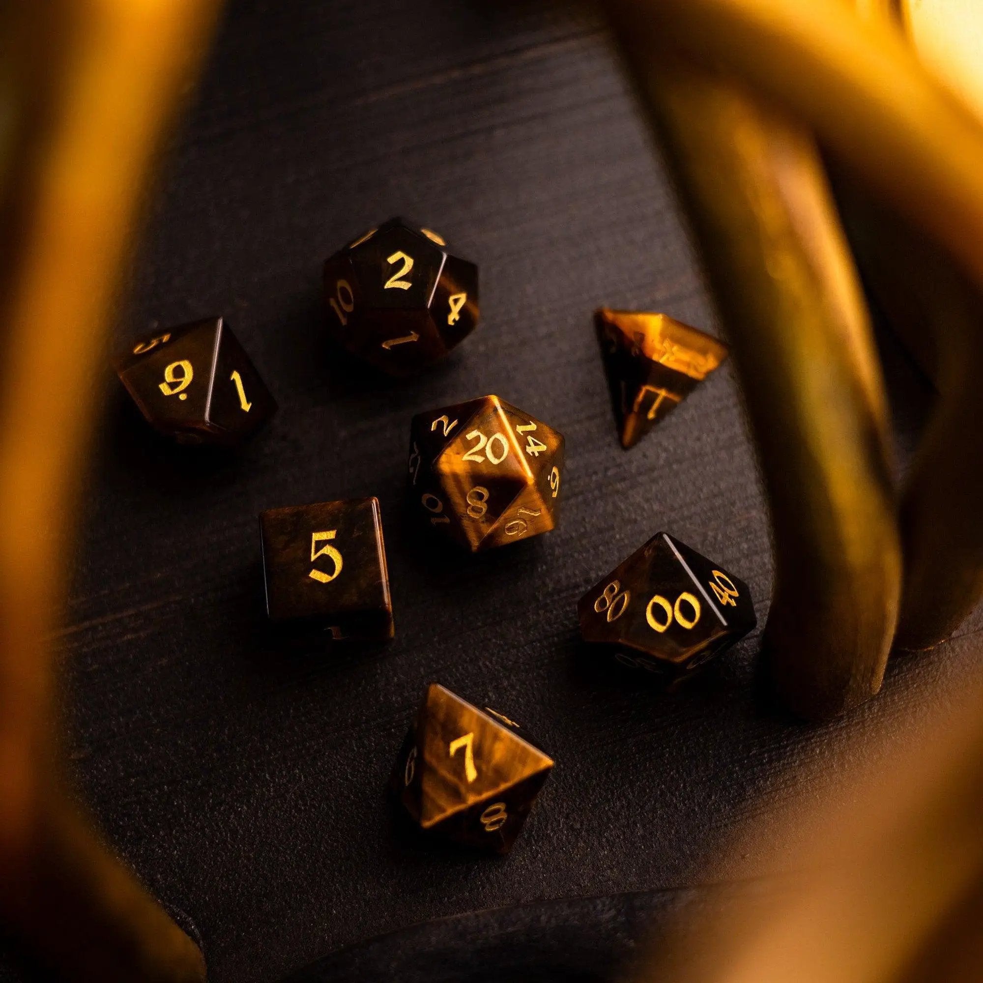 Yellow Tigers Eye gemstone DND dice set by Runic Dice, featuring polished six-sided dice with natural golden-brown patterns.