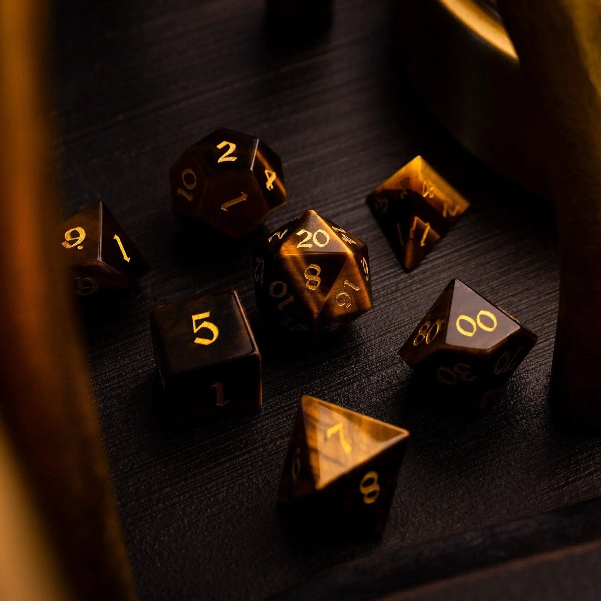 Yellow Tigers Eye gemstone DND dice set by Runic Dice featuring polished, vibrant yellow dice with natural gemstone patterns for tabletop gaming.