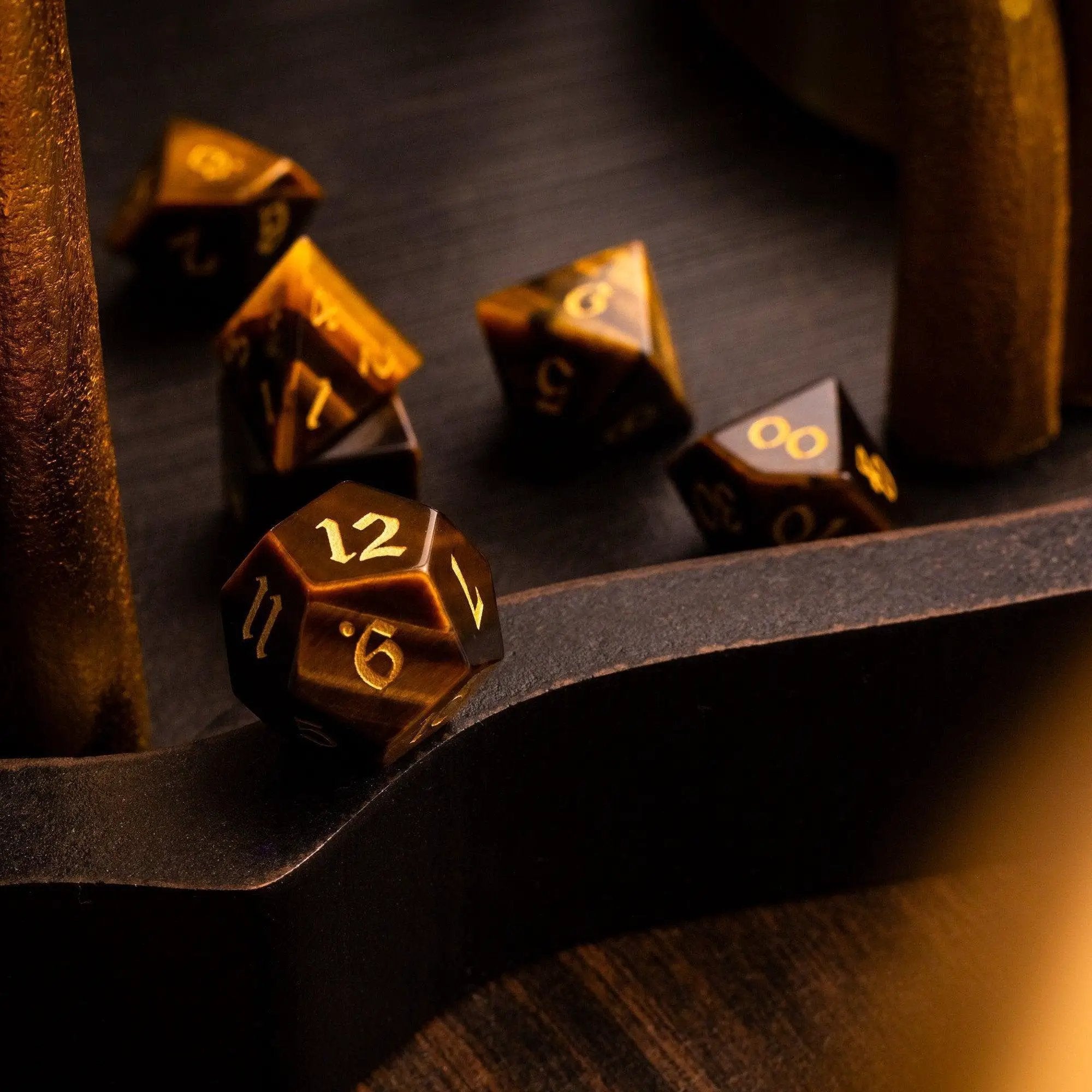 Yellow Tigers Eye gemstone DND dice set by Runic Dice, featuring polished, mult-sided dice with natural yellow and brown patterns.