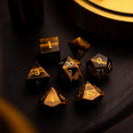 Yellow Tigers Eye gemstone DND dice set by Runic Dice, featuring polished, multi-sided gemstone dice for tabletop gaming.
