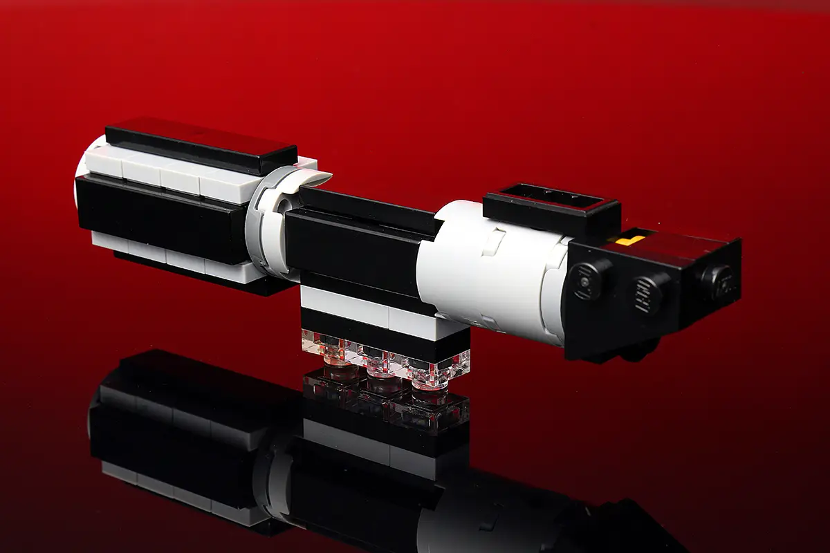 Custom LEGO Mini Dark Lord Lightsaber kit by B3 Customs, featuring a detailed dark-colored lightsaber with intricate design.