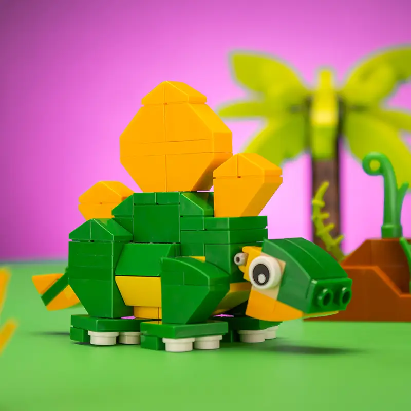 Colorful Stegosaurus custom LEGO dinosaur set by B3 Customs, featuring detailed LEGO brick construction with vibrant colors.