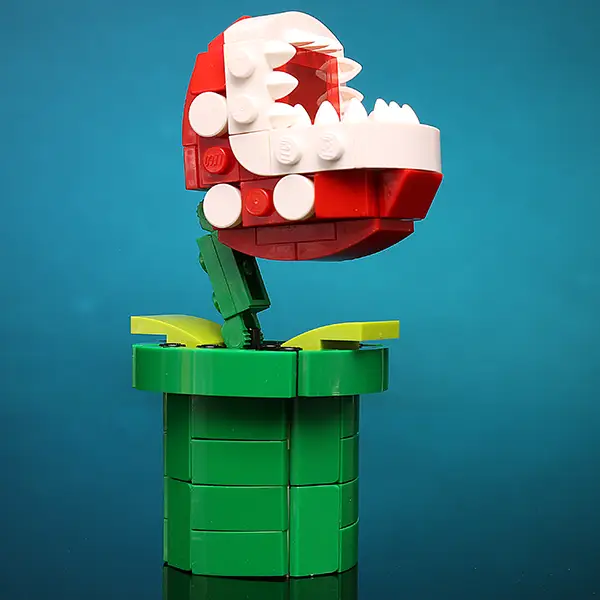 Colorful custom LEGO kit from B3 Customs featuring The Hungry Plant design, assembled with vibrant LEGO bricks on a neutral background.