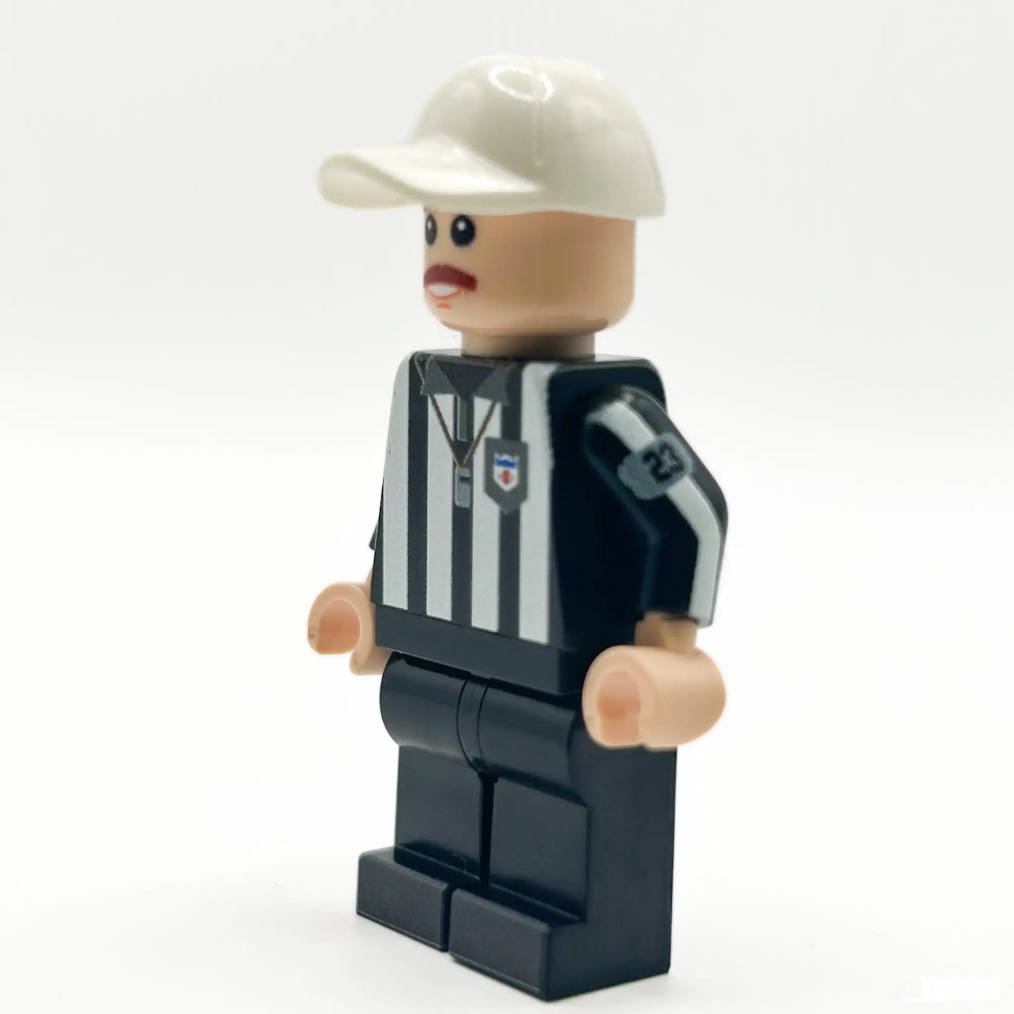 Custom LEGO football referee minifigure by B3 Customs, featuring a referee uniform, whistle, and LEGO-style details.
