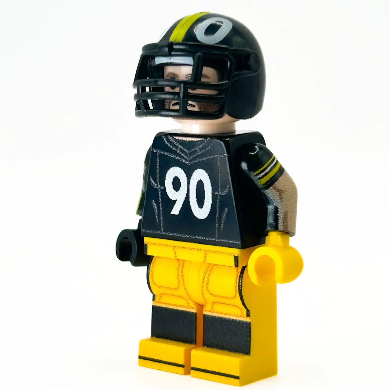 Custom Pittsburgh football player minifigure made with LEGO parts by B3 Customs, featuring detailed football uniform and helmet.