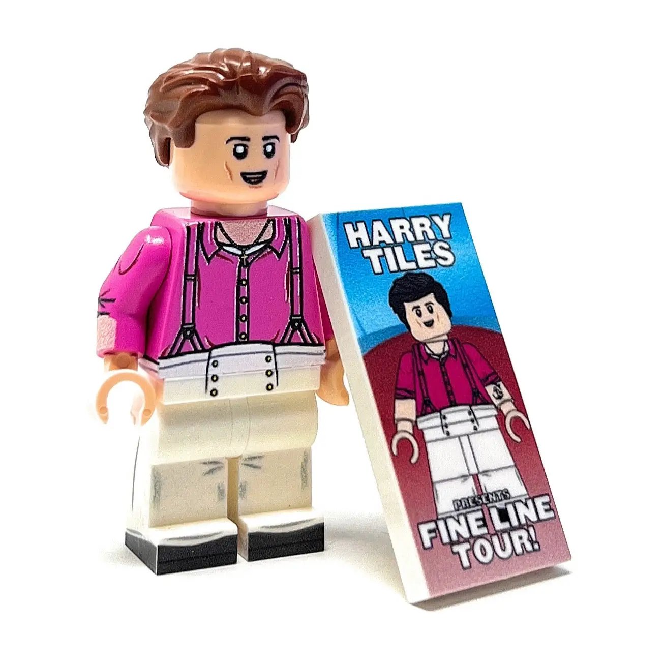 Custom LEGO Minifigure of Harry Tiles by B3 Customs holding a concert poster, representing a musician on the Fine Line Tour.