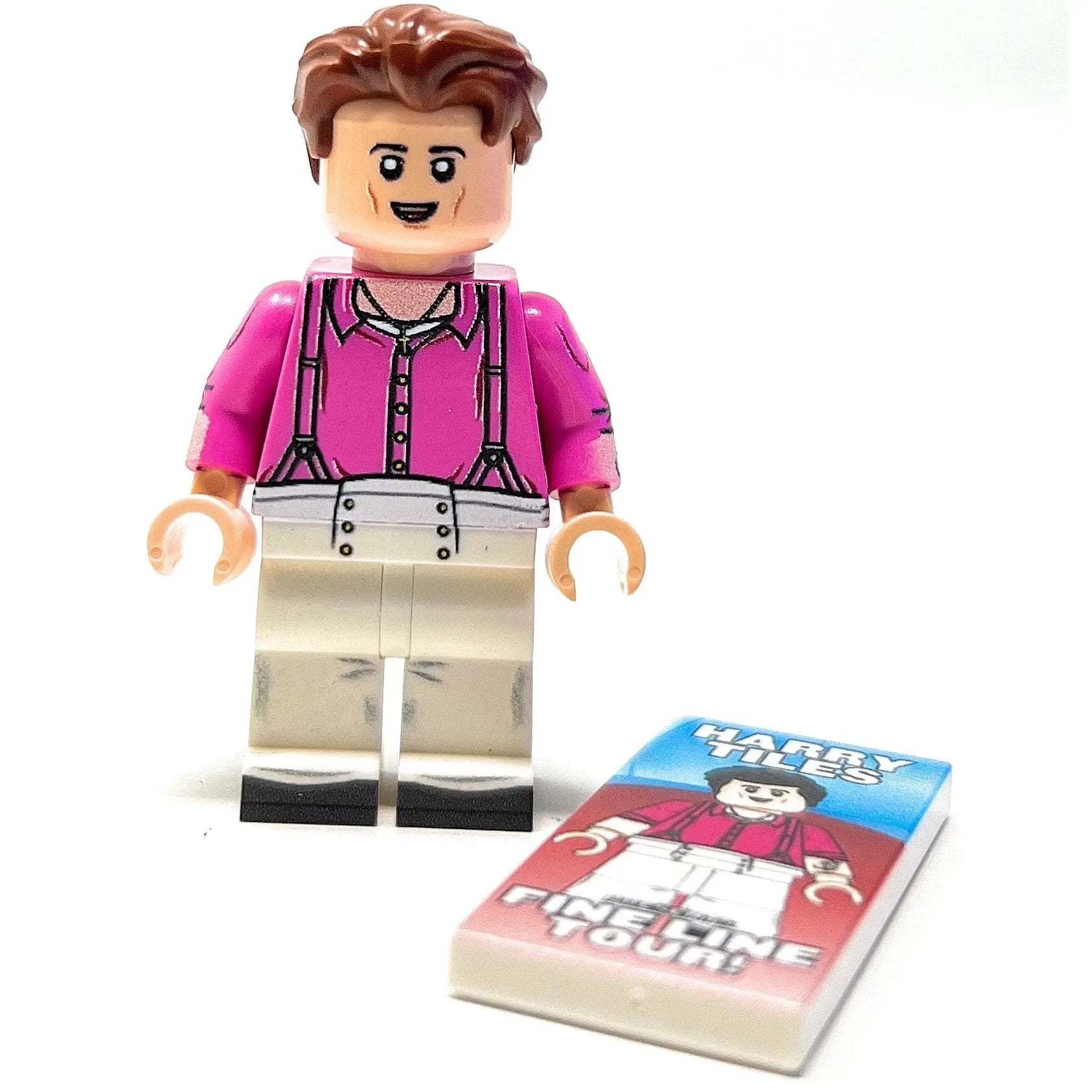 Custom LEGO minifigure of Harry Tiles by B3 Customs holding a concert poster for the Fine Line Tour.