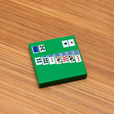 Custom printed LEGO solitaire 2x2 tile by B3 Customs featuring intricate design on white LEGO brick.