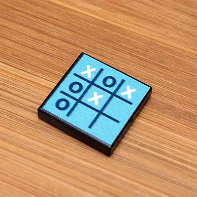 Custom LEGO Tic-Tac-Toe 2x2 tile made with B3 Customs LEGO parts, featuring a printed game grid on colorful LEGO tiles.