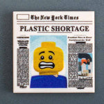 Custom printed LEGO B3 Customs plastic shortage newspaper tile, 2x2 size featuring a headline about the plastic shortage.