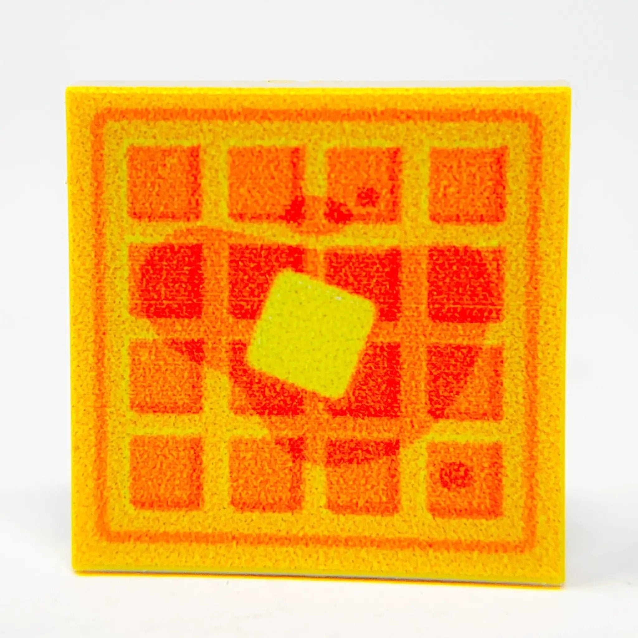 Custom printed square waffle tile by B3 Customs, showcasing a detailed design on a 2x2 ceramic tile.