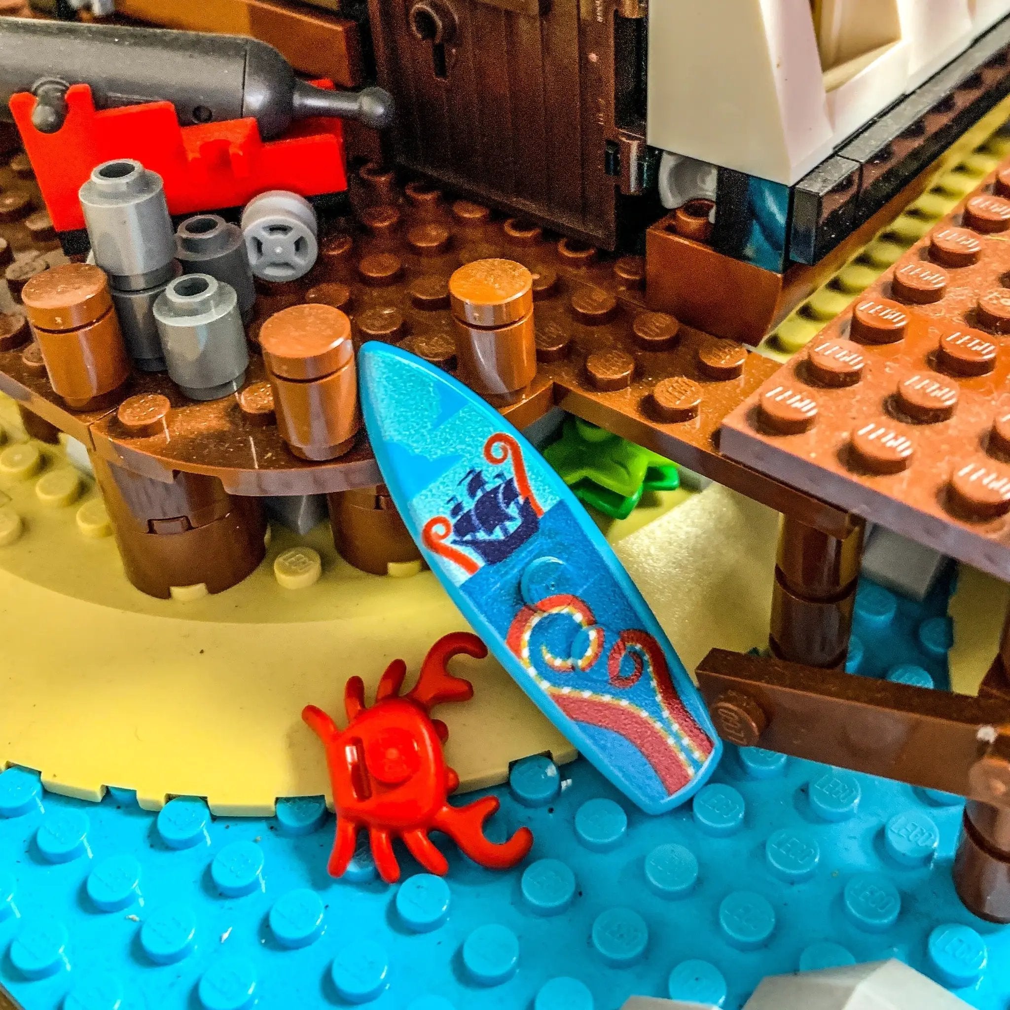 Printed Kraken surfboard made from LEGO bricks by B3 Customs, featuring a detailed Kraken design on a colorful surfboard.
