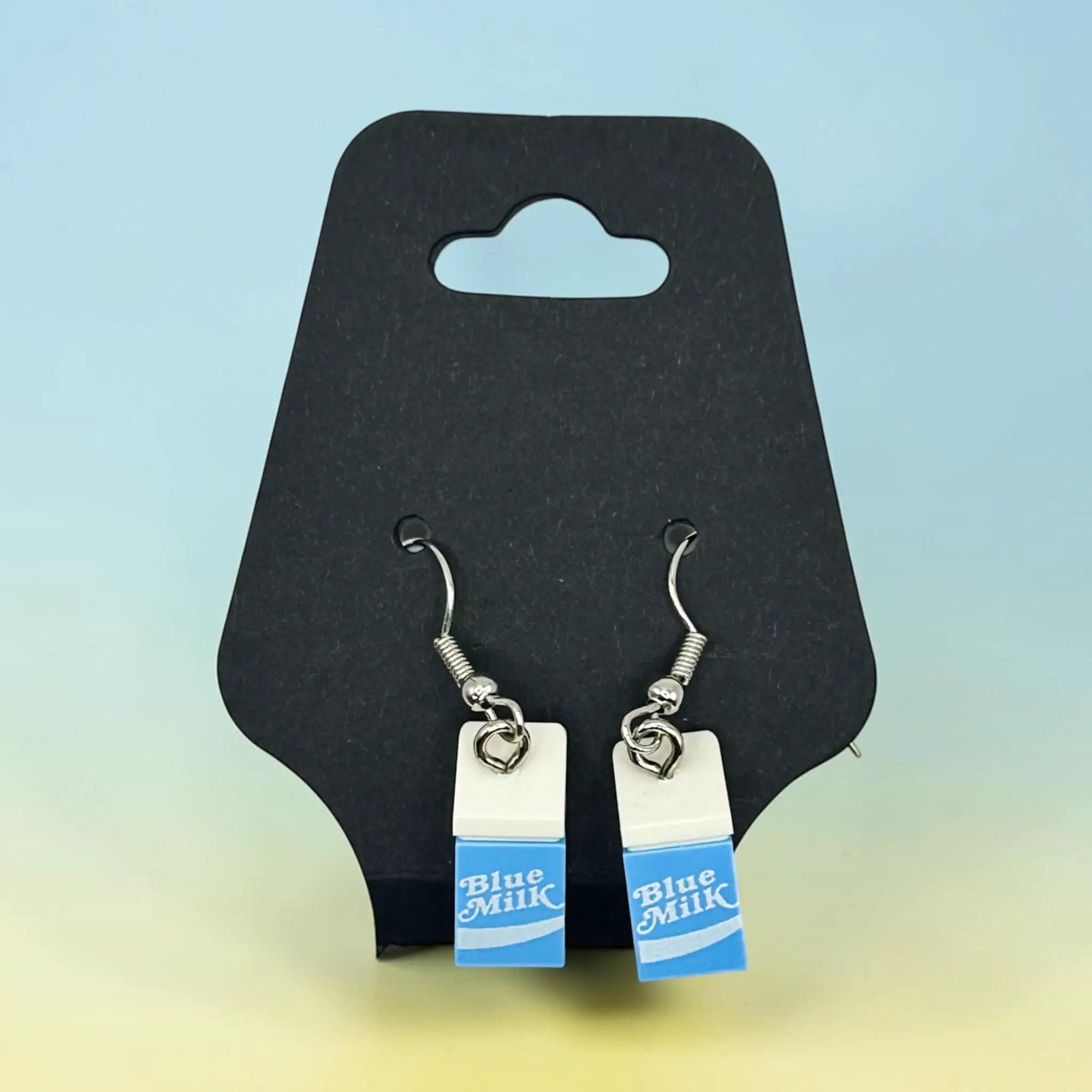 Blue milk brick earrings by B3 Customs featuring vibrant blue brick design and silver hooks on a white background.