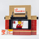 LEGO Chick-Fil-A food stand set with B3 Customs employee minifig, featuring a detailed brick-built fast food restaurant scene.