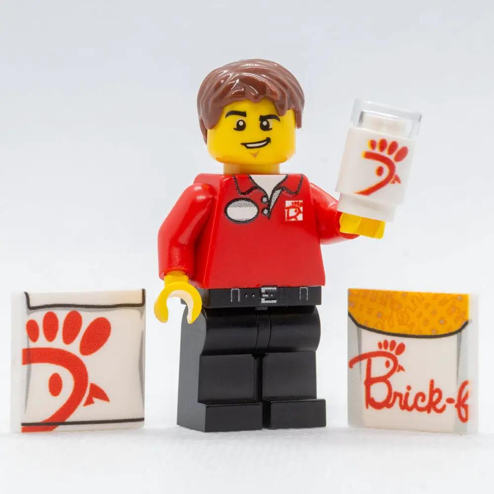 LEGO Chick-Fil-A employee minifig from Brick-Fil-A food stand by B3 Customs, detailed LEGO figure with uniform and accessories.