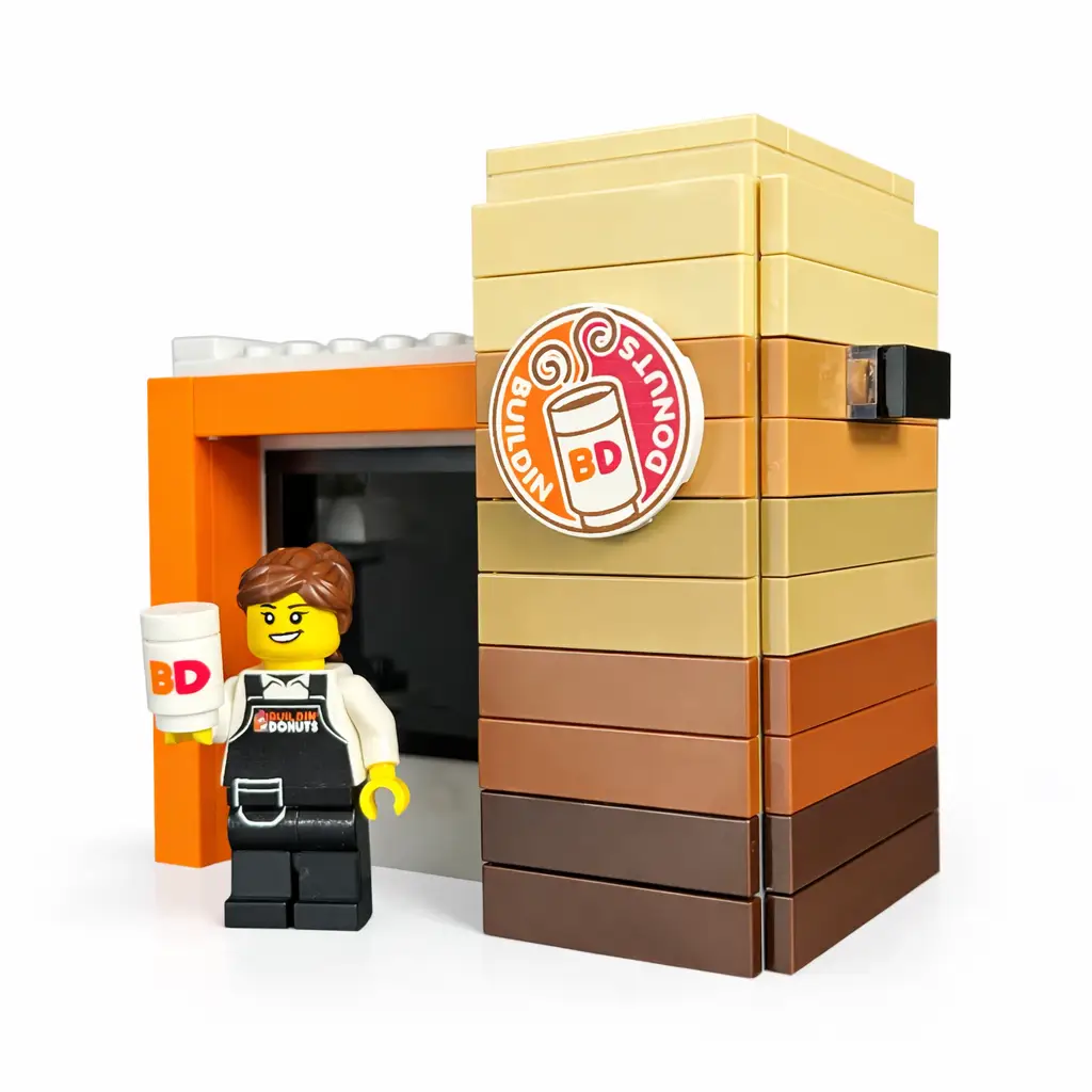 LEGO Buildin' Donuts Stand with minifig by B3 Customs, featuring a custom LEGO food stand with donut displays and a minifigure.