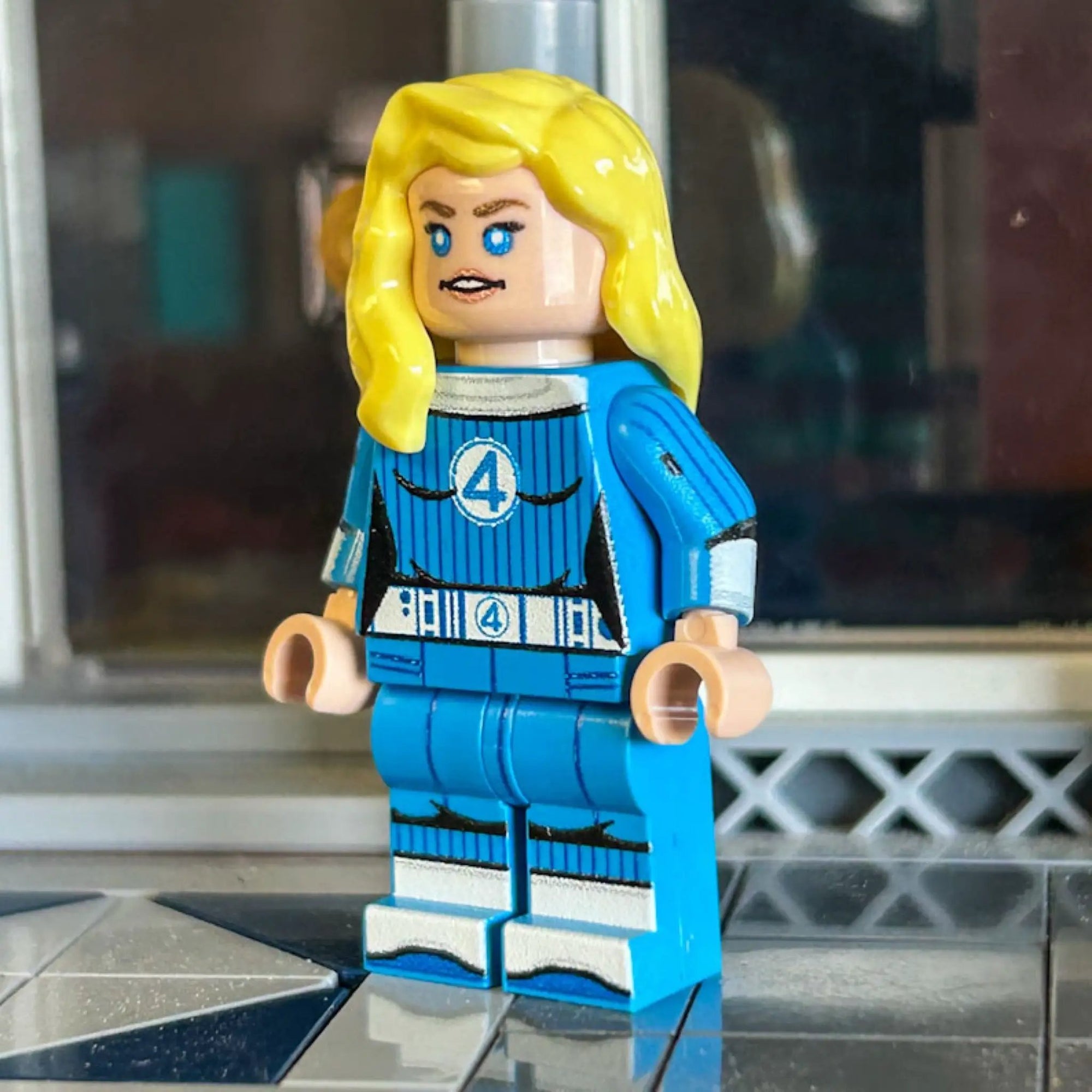 Disappearing Woman LEGO sculpture by B3 Customs featuring LEGO parts in a dynamic pose with detailed clothing and accessories.