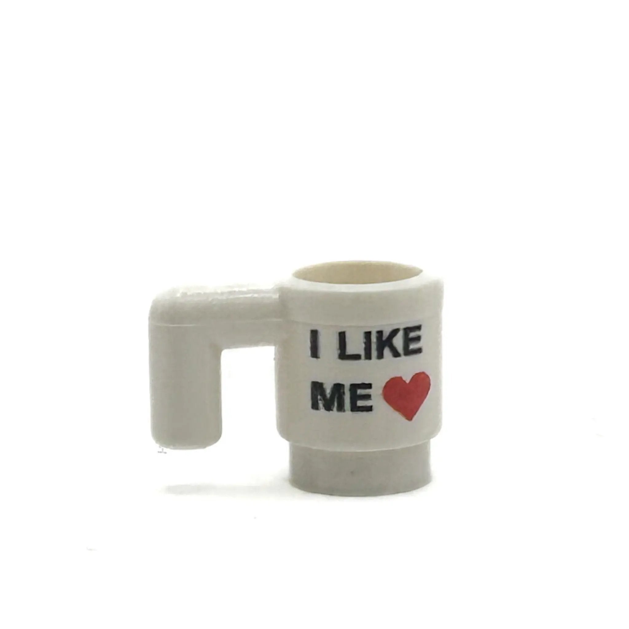 B3 Customs I Like ME Heart Mug for Minifigs from Deadpool 3, featuring a red heart design on a ceramic mug.