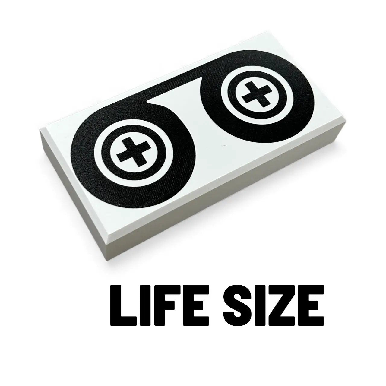 Life-size 90s black tape reels tile for cosplay by B3 Customs, featuring realistic vintage cassette tape design.