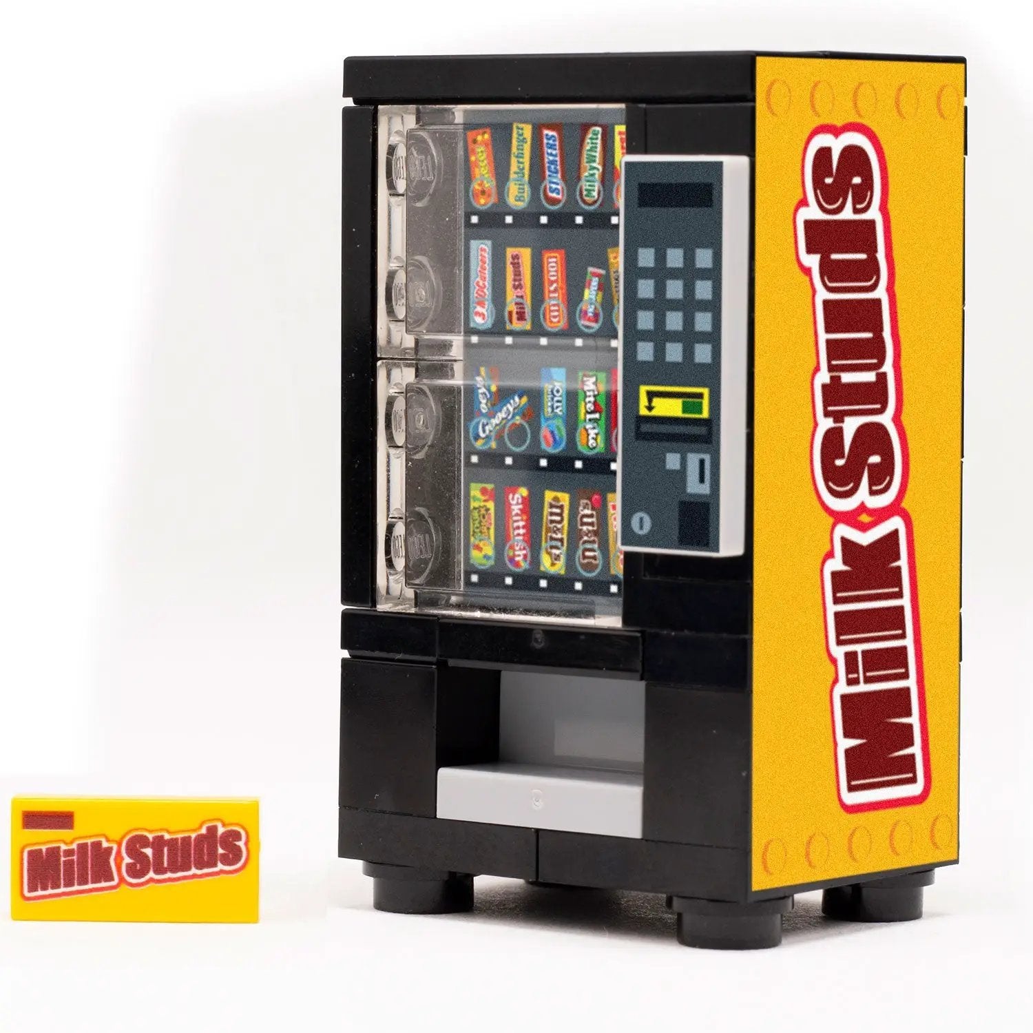 Lego Milk Studs from B3 Customs shaped like a candy vending machine with colorful details and miniature vending slot.