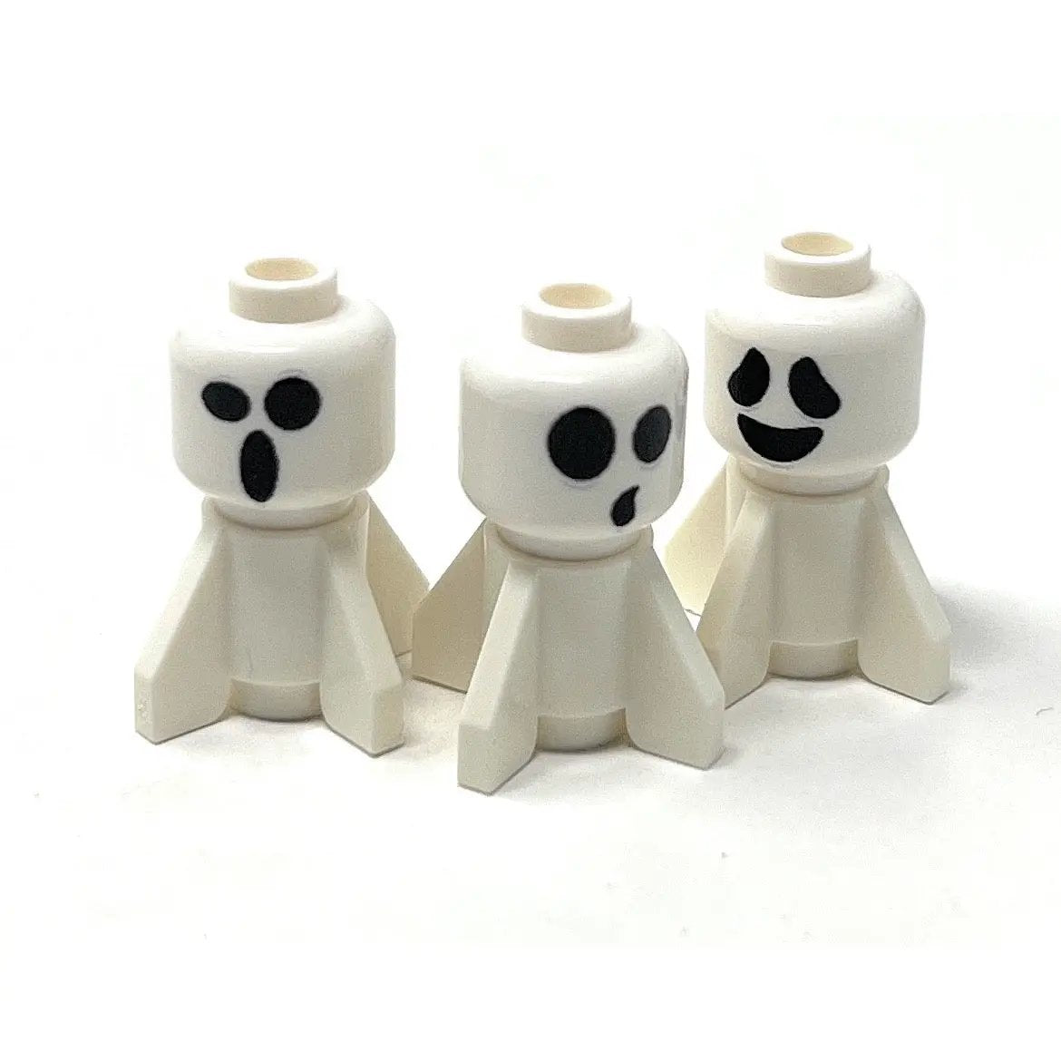 Set of three Mini Baby Halloween Ghosts made with LEGO parts by B3 Customs, featuring small ghost figures with pumpkin accessories.