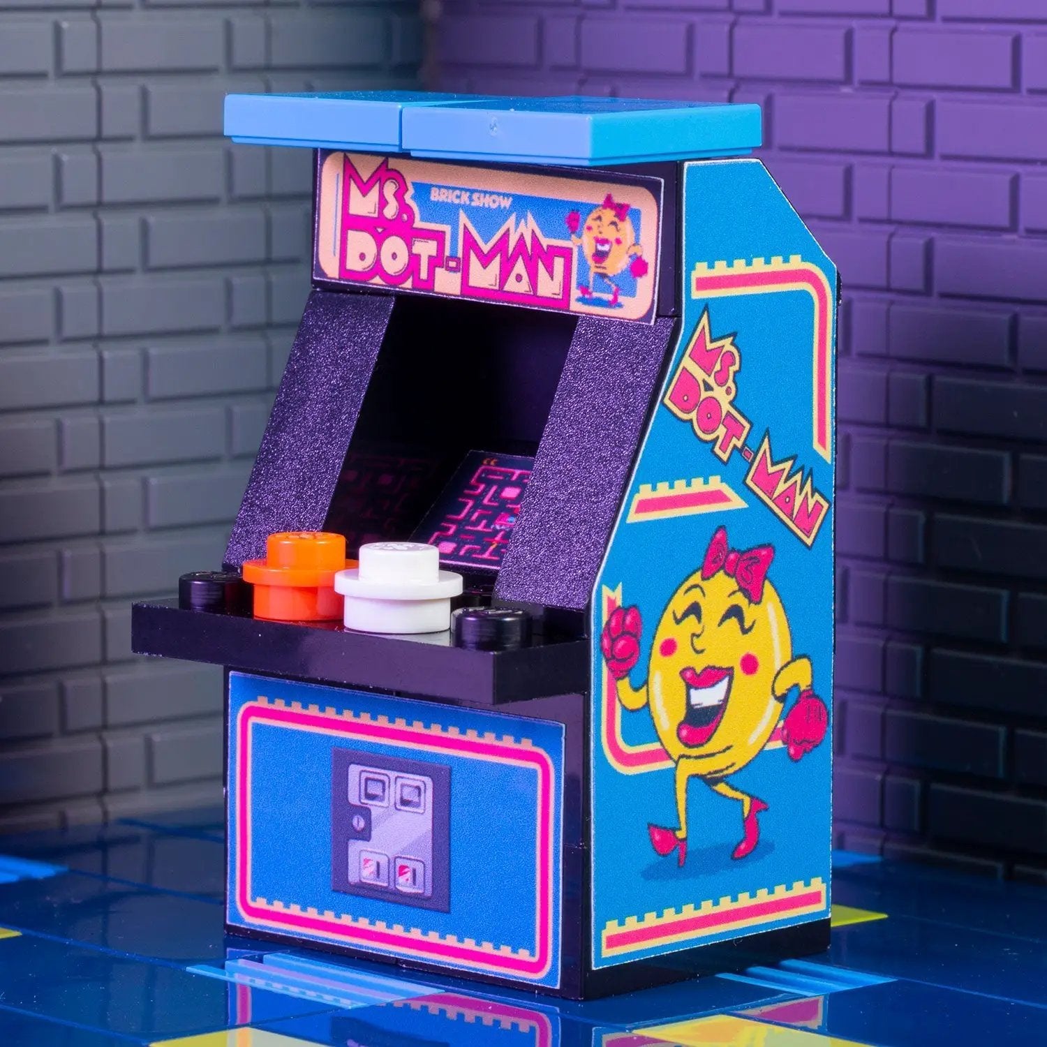 Custom Lego Ms. Dot-Man arcade machine by B3 Customs, featuring detailed brick construction and classic arcade design.