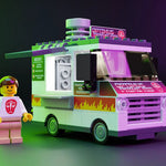 Optimus Prime ribs food truck by B3 Customs with mini-figure, detailed model featuring vibrant colors and truck design.