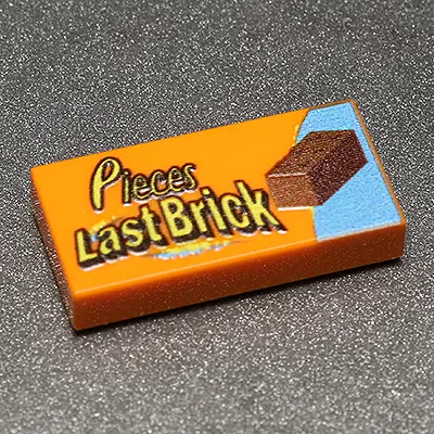 Custom printed Pieces Last Brick 1x2 tile from B3 Customs featuring a unique and colorful brick design.