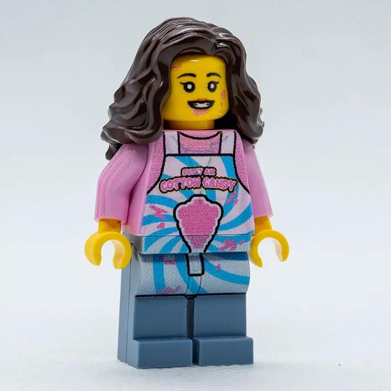 Lego cotton candy stand with a B3 Customs employee minifigure, featuring colorful cotton candy and playful toy setup.