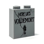 LEGO Voldemort tombstone Halloween decoration made with B3 Customs bricks, featuring a detailed black and gray brick-built design.