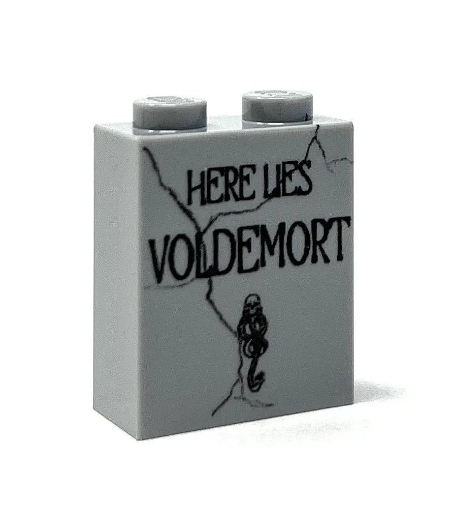 LEGO Voldemort tombstone Halloween decoration made with B3 Customs bricks, featuring a detailed black and gray brick-built design.