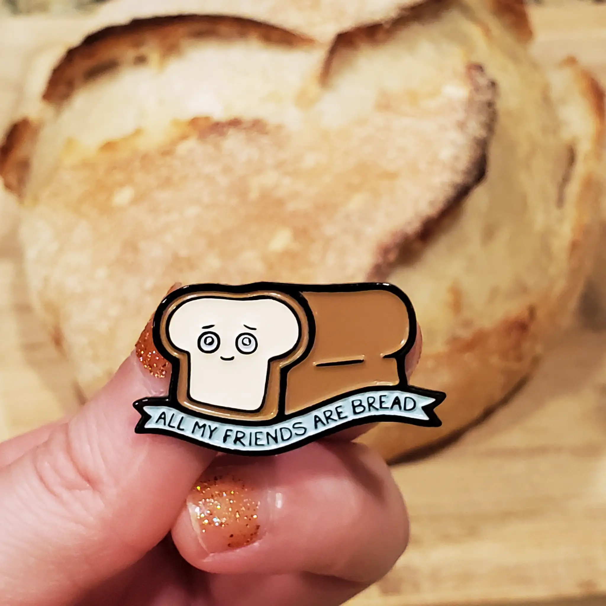 Kolorspun All My Friends Are Bread enamel pin featuring a square bread design on a white background.