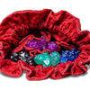 Red velvet Dragon Storm dice bag with dragon scale design and pockets, perfect for tabletop gaming and fantasy enthusiasts.