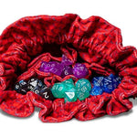 Red velvet Dragon Storm dice bag with dragon scale design and pockets, perfect for tabletop gaming and fantasy enthusiasts.