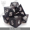 Blackwoods wood dice set in gift box from DNDDICE.COM, featuring handcrafted wooden gaming dice for tabletop games.