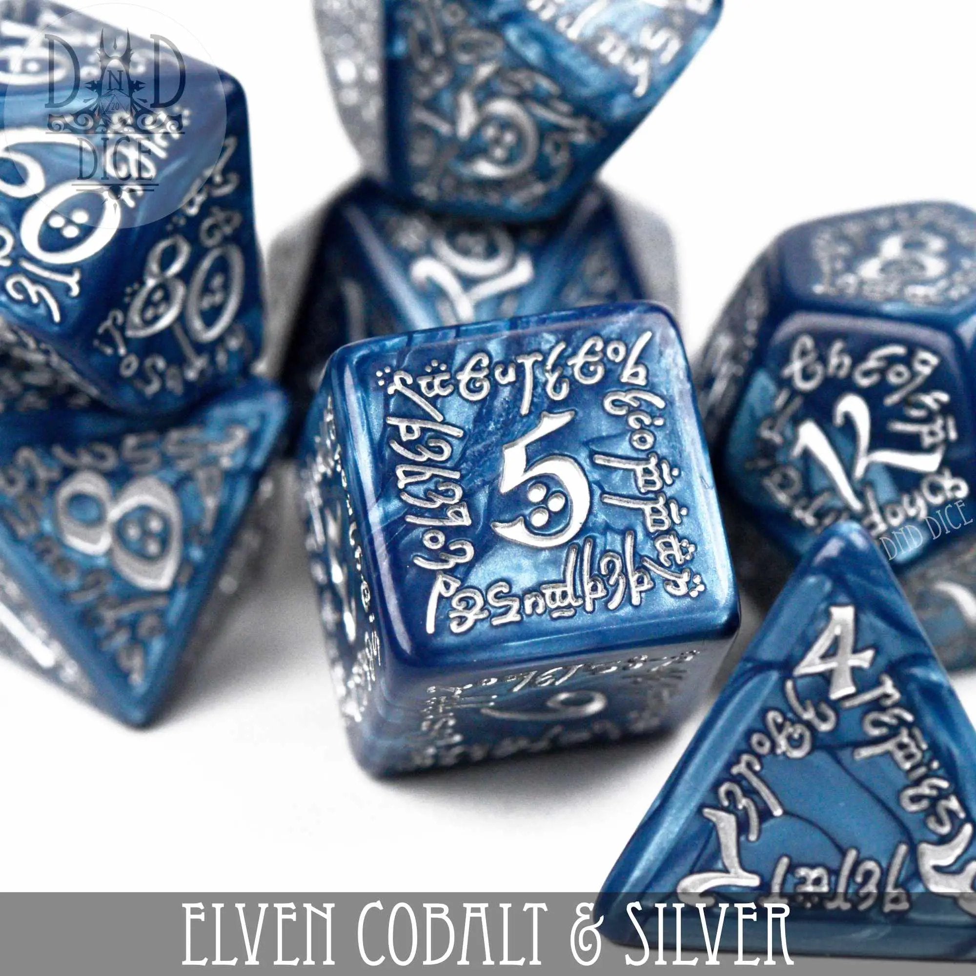 Elven cobalt and silver dice set from DNDDICE.COM featuring intricately designed polyhedral gaming dice for tabletop games.