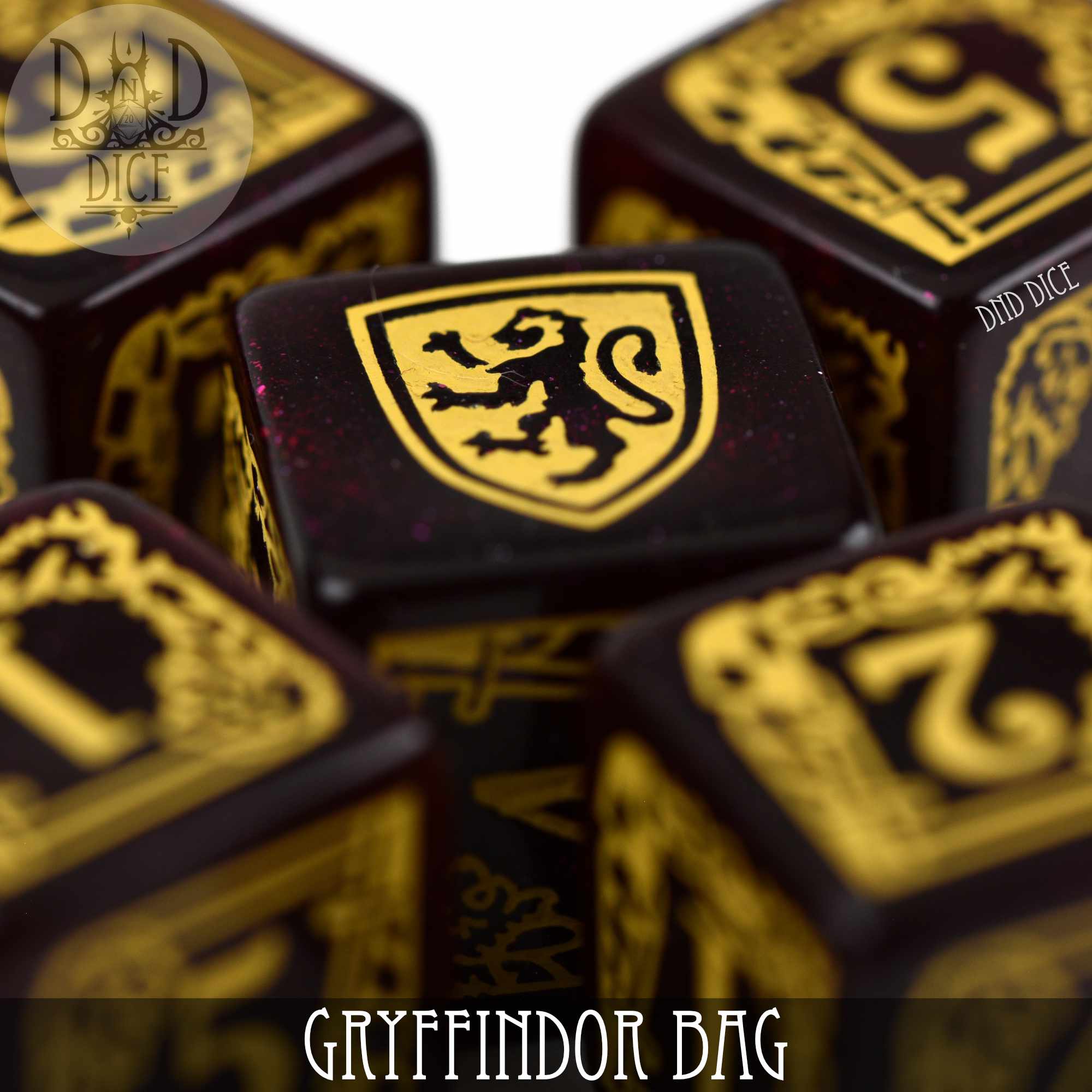Gryffindor-themed dice bag with five 6-sided dice from DNDDICE.COM, featuring red and gold design and Harry Potter branding.
