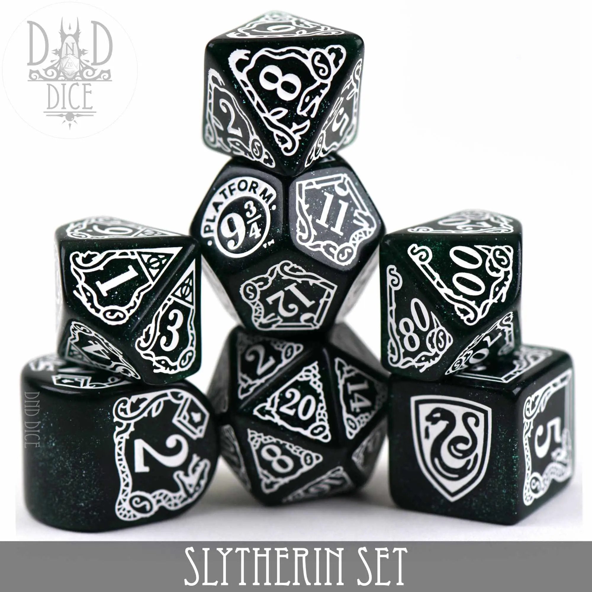 Green and silver Harry Potter Slytherin dice set with intricate designs from DNDDICE.COM, perfect for gaming and collection.