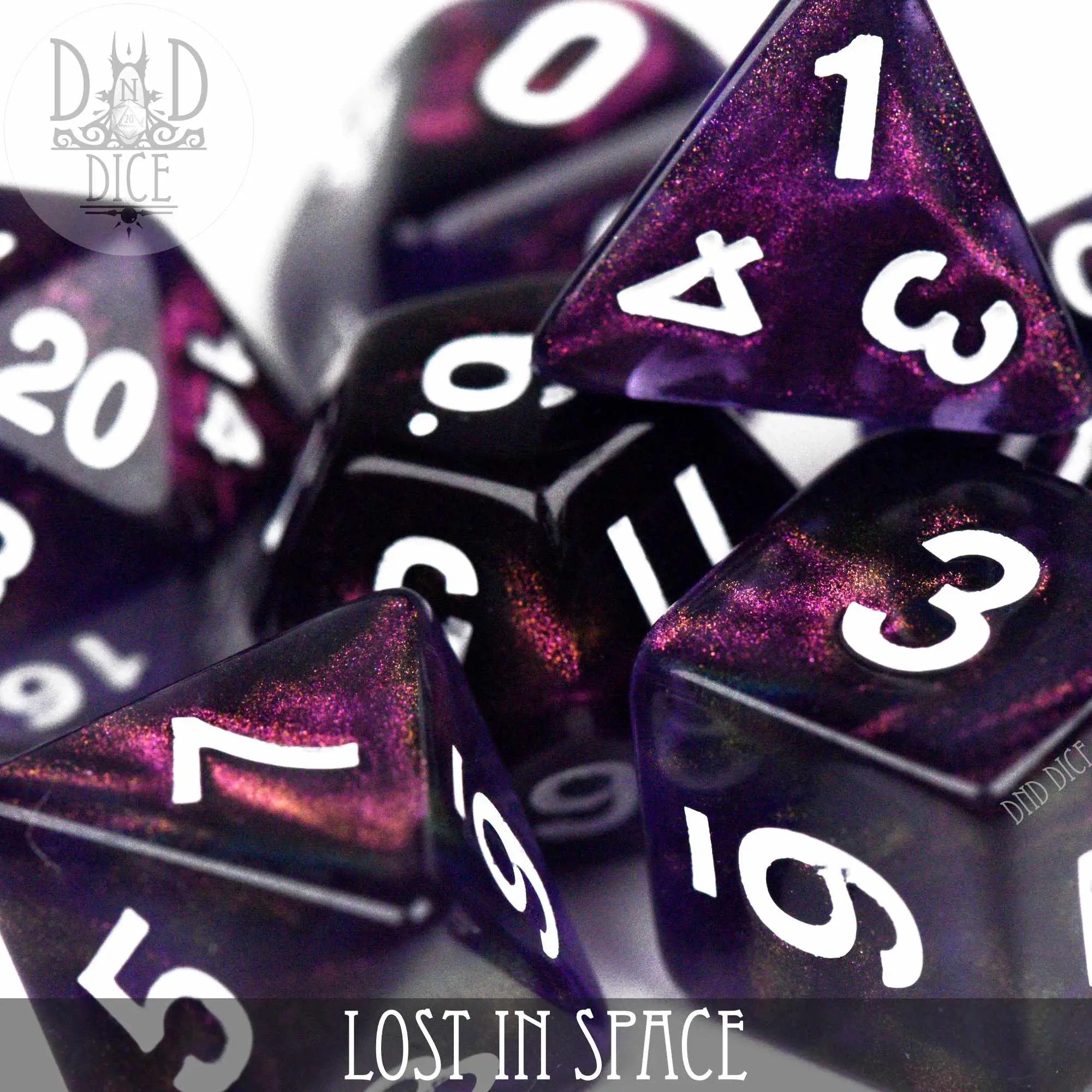 Lost in Space dice set by DNDDICE.COM, featuring colorful space-themed polyhedral dice for tabletop gaming.