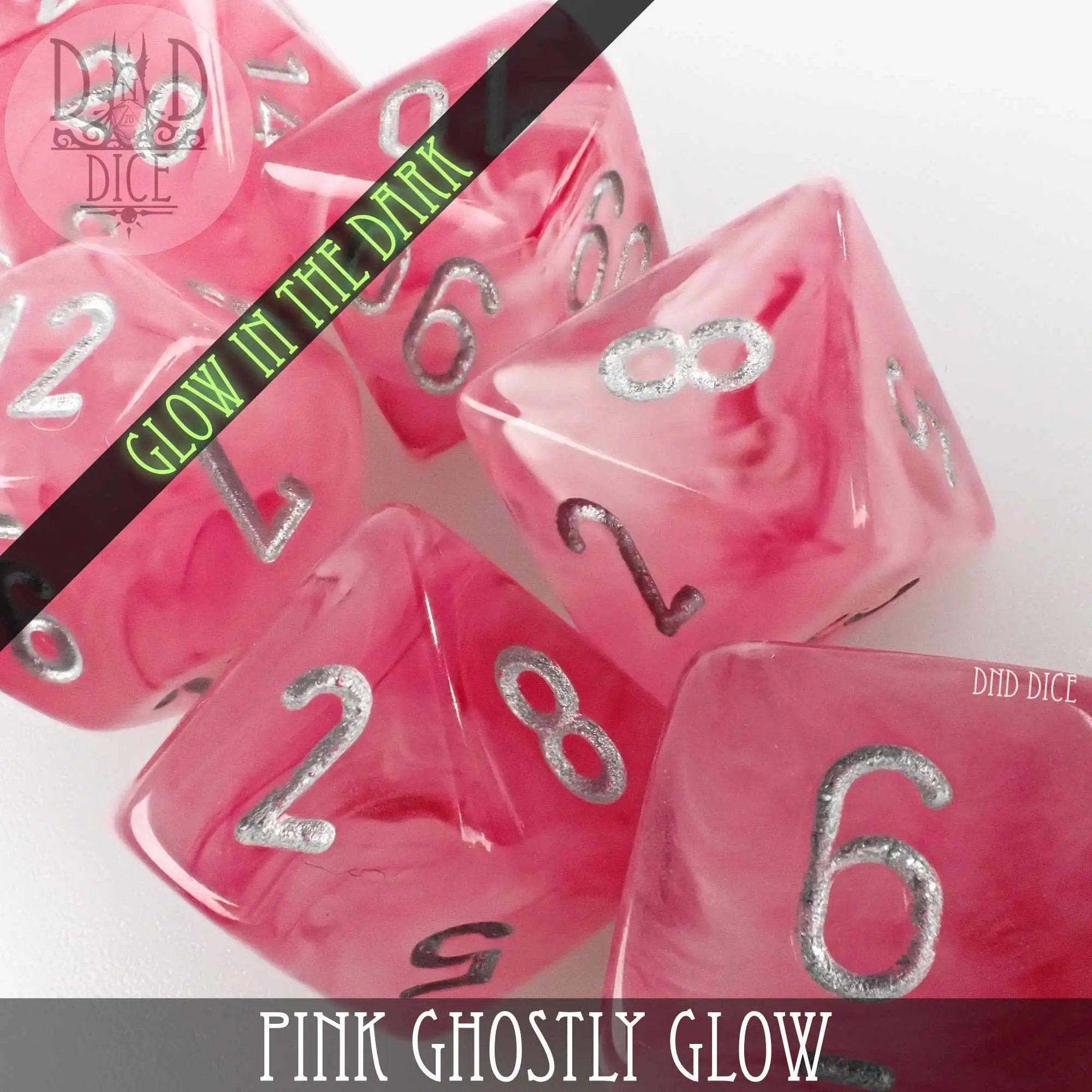 Pink Ghostly Glow dice set from DNDDICE.COM featuring glowing, translucent gaming dice for tabletop role-playing games.