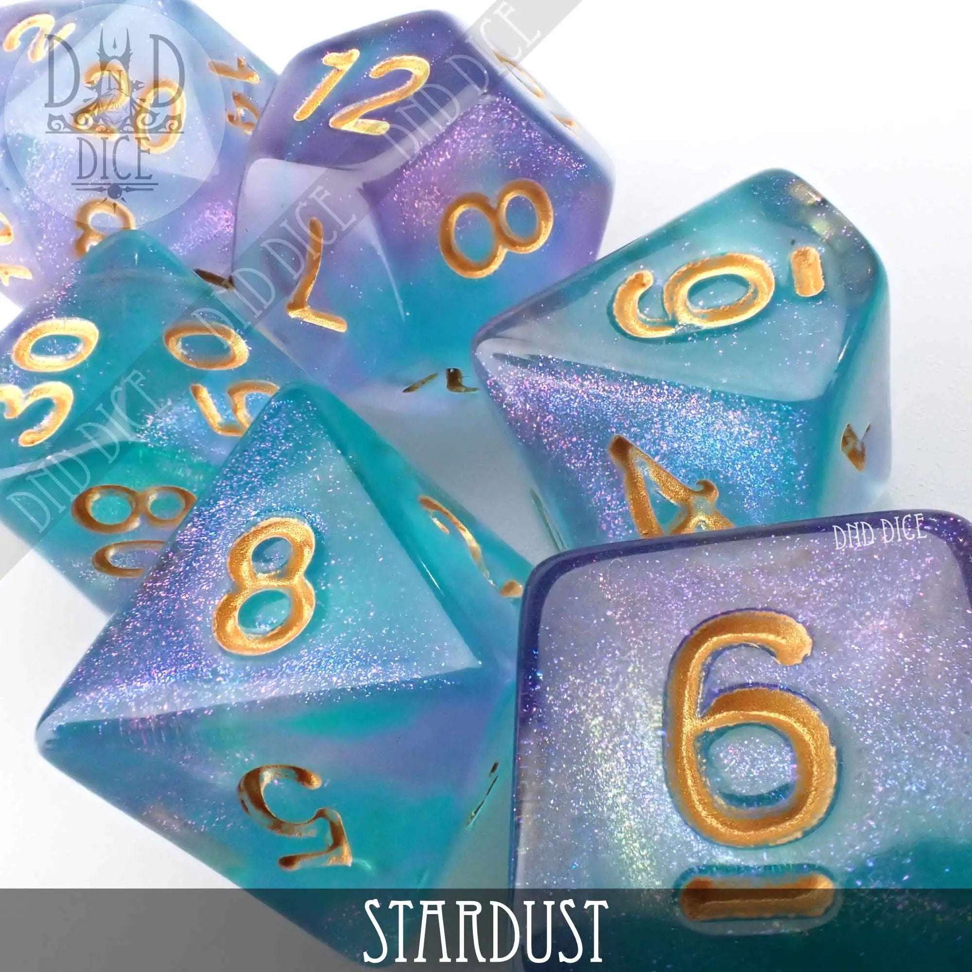 Set of shimmering Stardust Dice from DNDDICE.COM featuring colorful, cosmic-themed polyhedral dice for tabletop gaming.